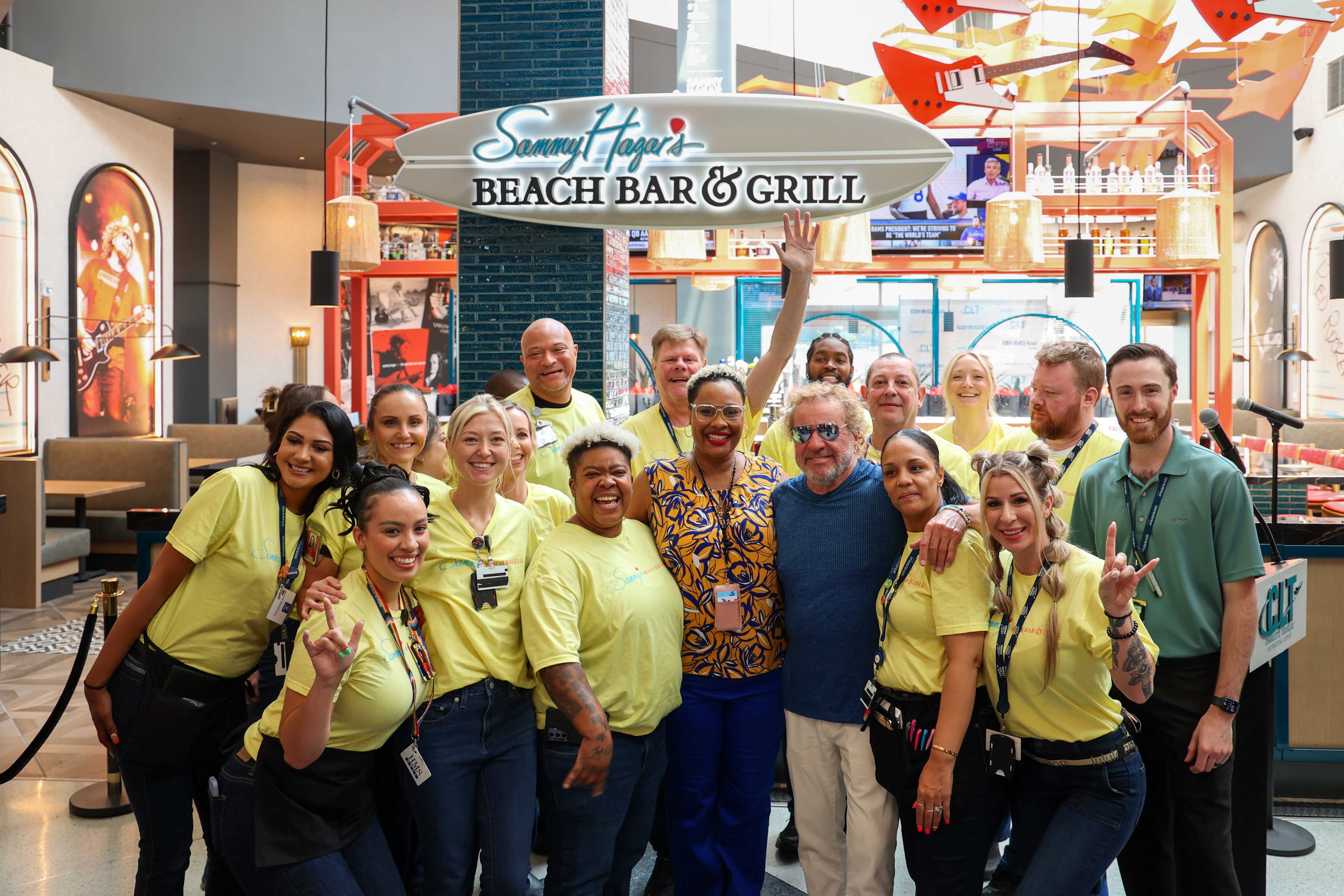 Sammy Hagar posing with Beach Bar Grill staff and team members 2