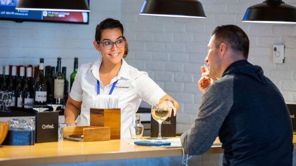 Servers serving wine Medium